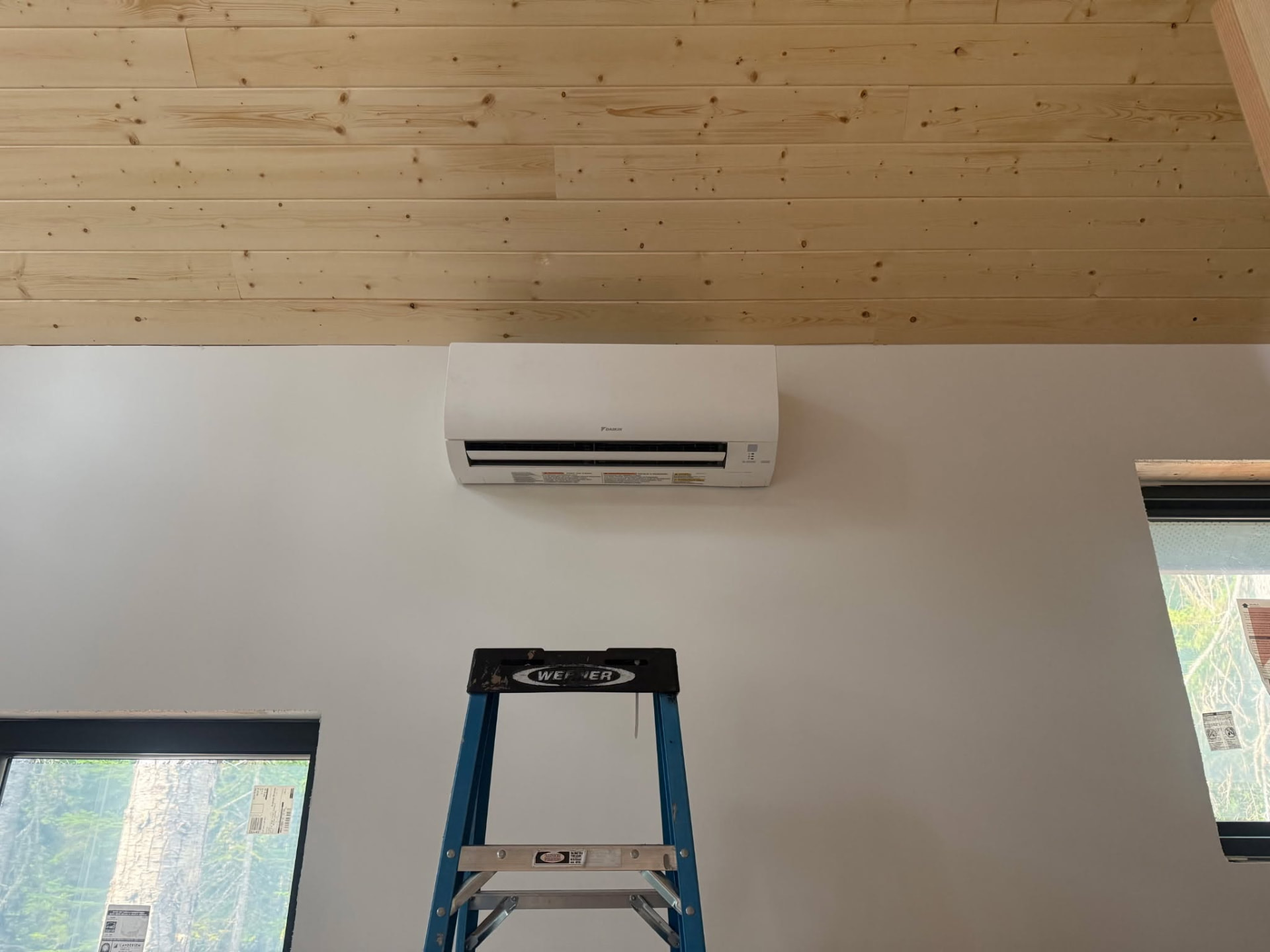 Mini split installed in a wood-ceiling cabin