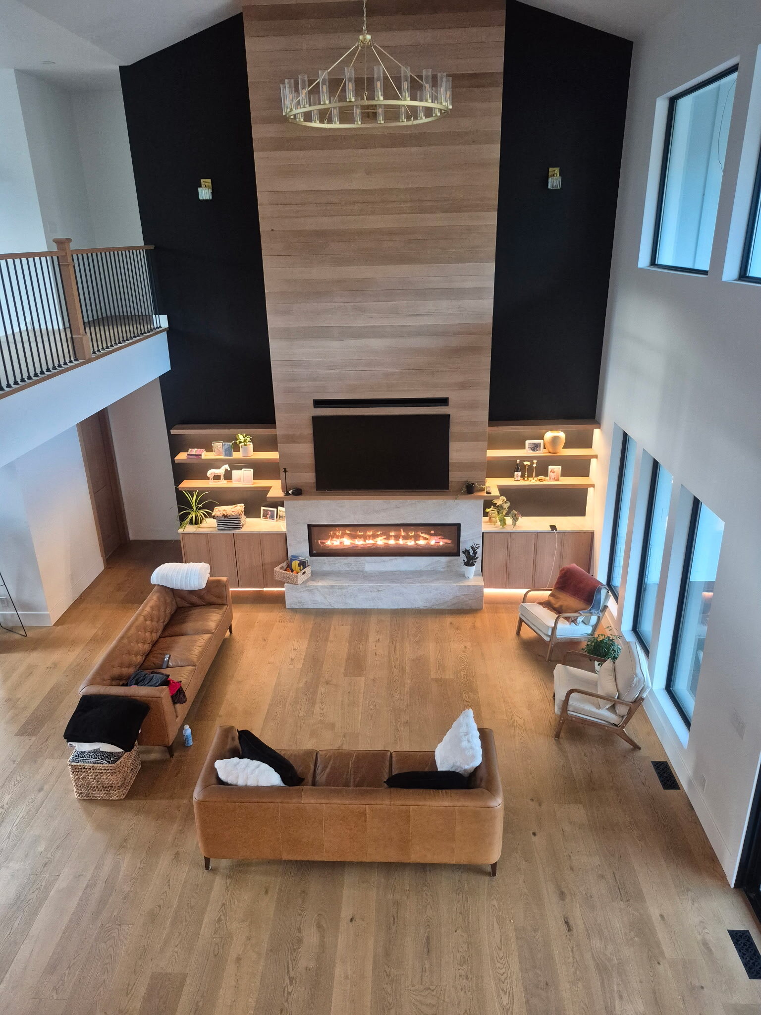 Two story great room with a wide linear gas fireplace installed by Central Air Solutions