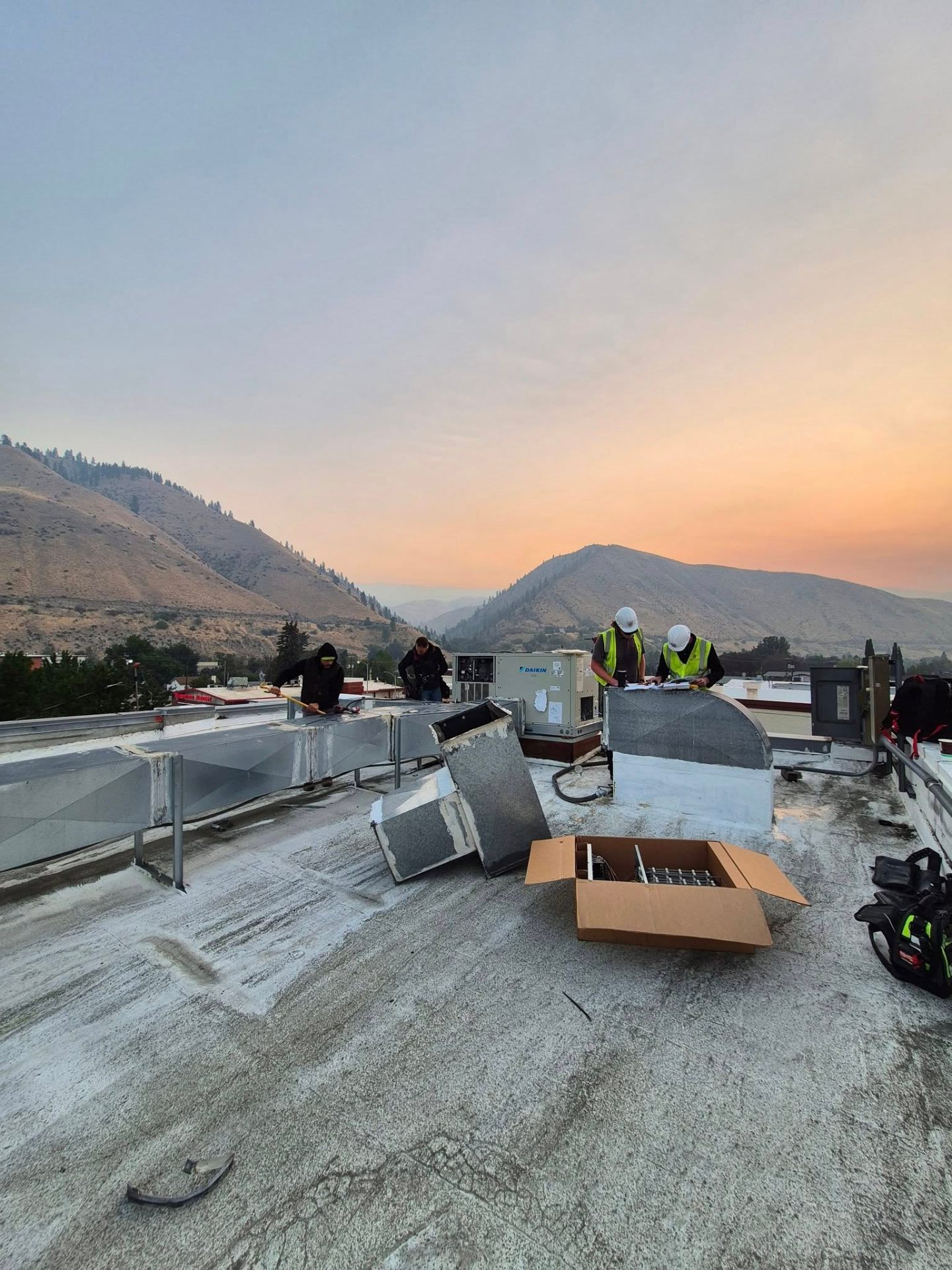 Rooftop unit framed by a Wenatchee sunset